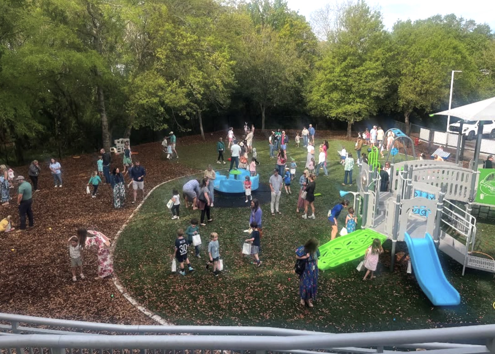 Families gather on the school playground at a community event